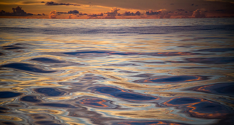 The water is so calm, it is hard to believe that the nearest land is more than 400 nautical miles away; it looks more like a painting than reality. The water is so calm, it is hard to believe that the nearest land is more than 400 nautical miles away; it looks more like a painting than reality.